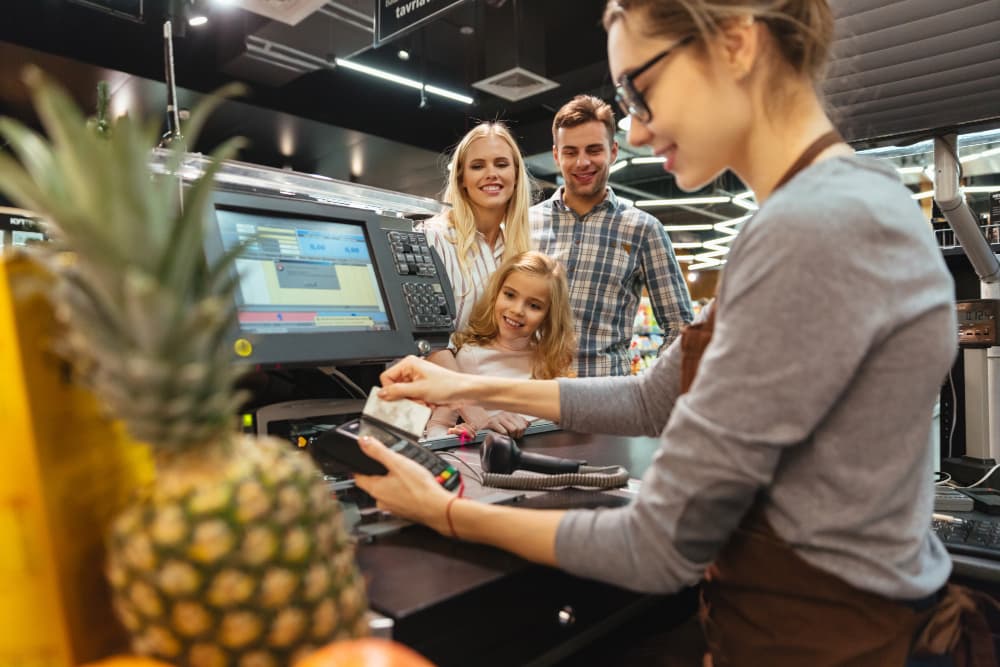 Store owner using PAK POS at the counter